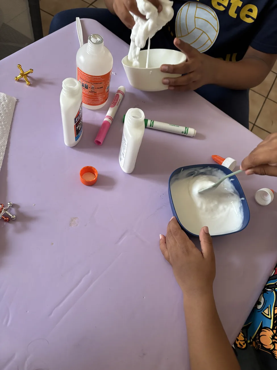 Children mixing homemade slime during a guided activity